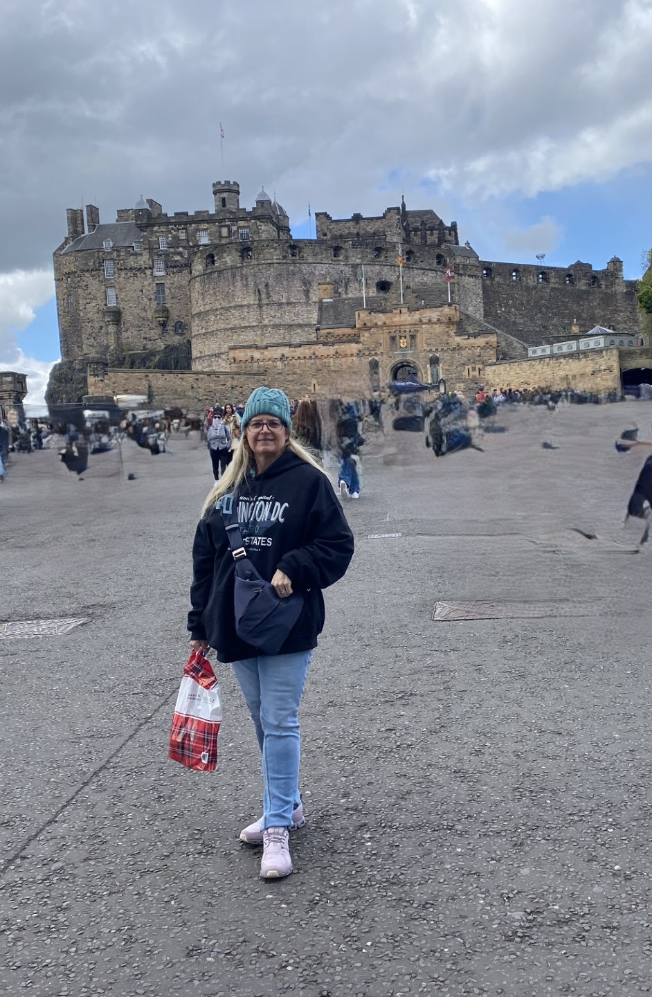 Kelley Jacobs in front of Edinburgh Castle during a Celebrity Eclipse British Isles cruise through Scotland, Ireland, and Wales.